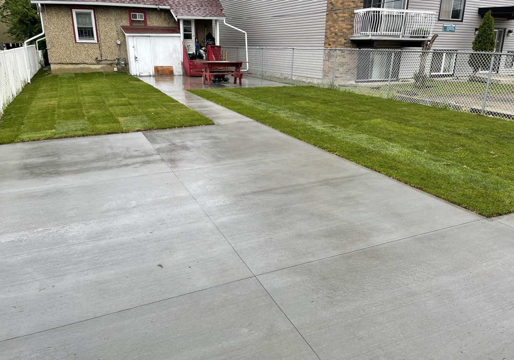 Broom finished concrete sidewalk and driveway by Creative Man